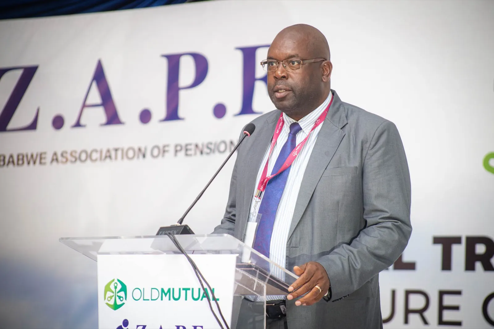 A speaker at the podium in front of the ZAPF banner at the 48th Annual General Meeting