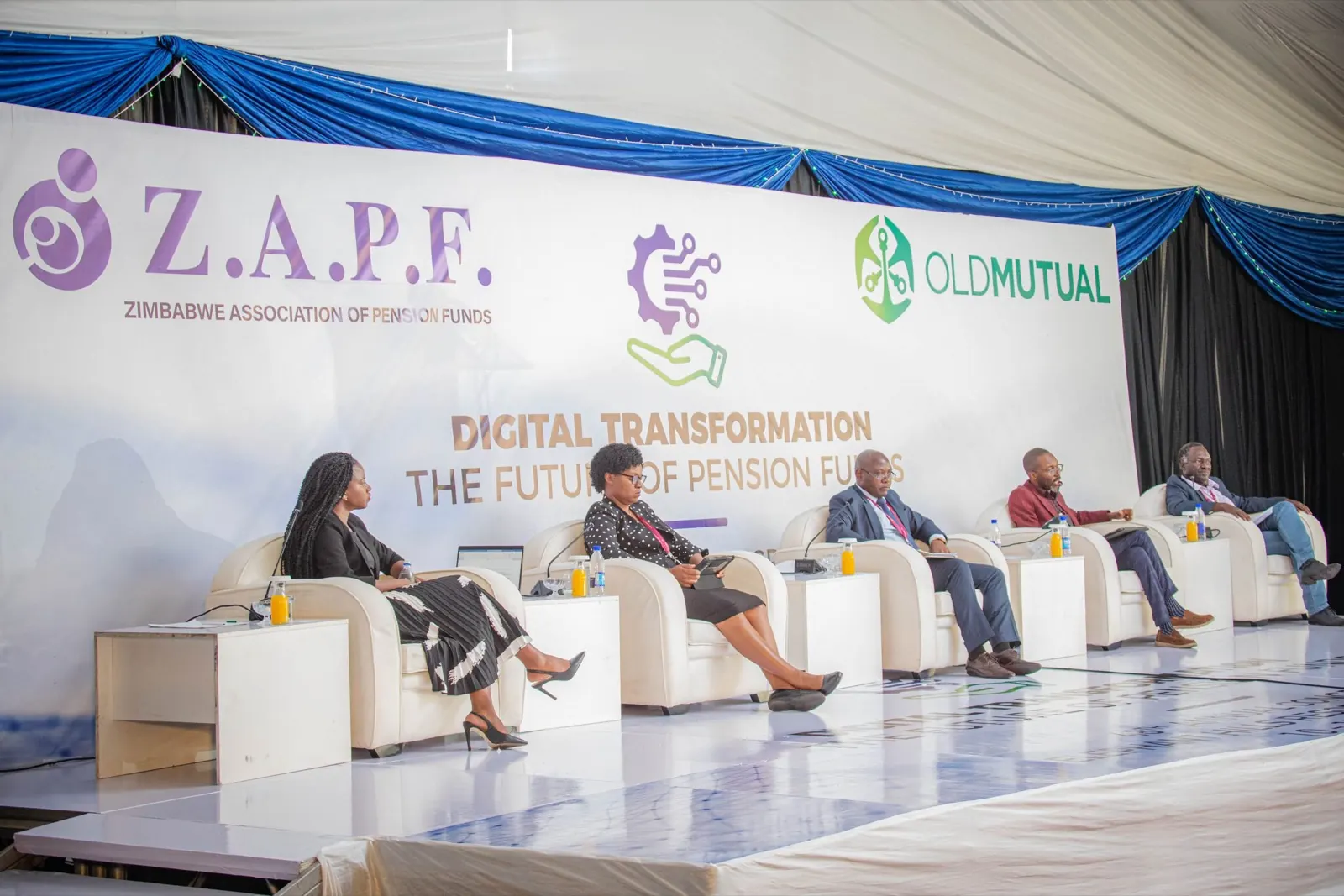 Panellists seated on stage at the 48th Annual General Meeting